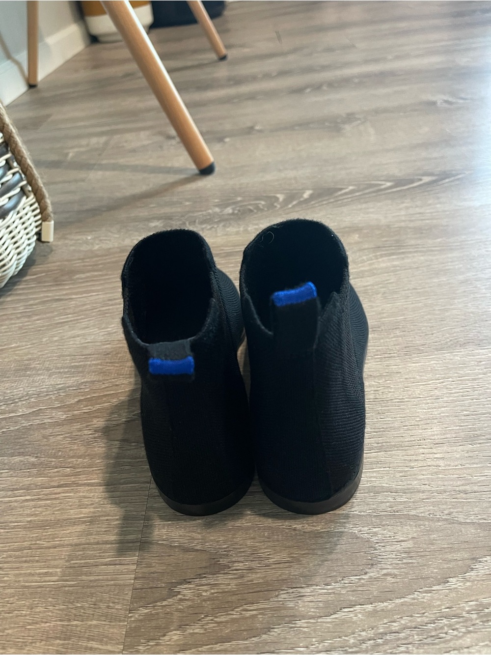Rothy’s Merino Ankle Boots in onyx black with a distinctive blue pull tab - Picture 3 of 13